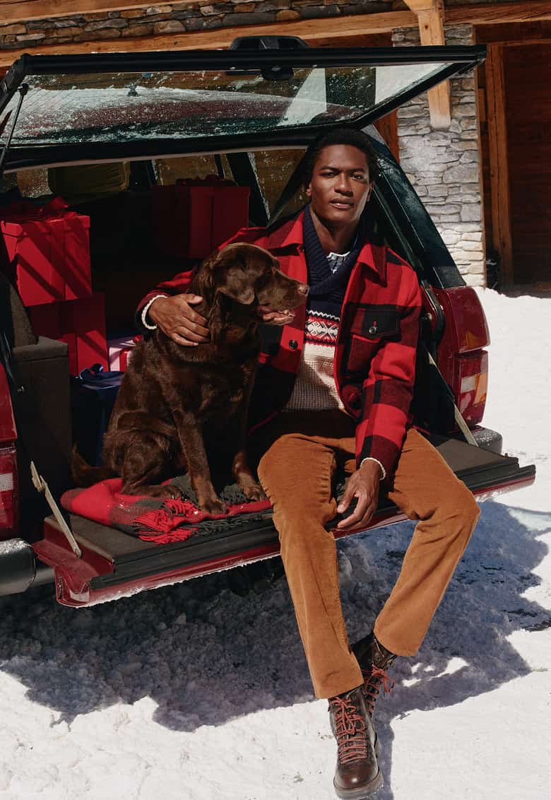 Model wearing Tommy Hilfger festive outfit.