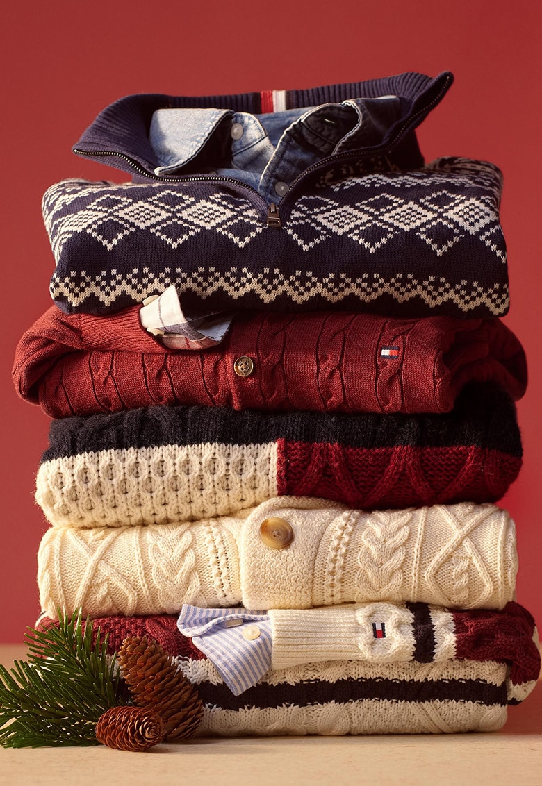 A stack of folded Tommy Hilfiger sweaters.