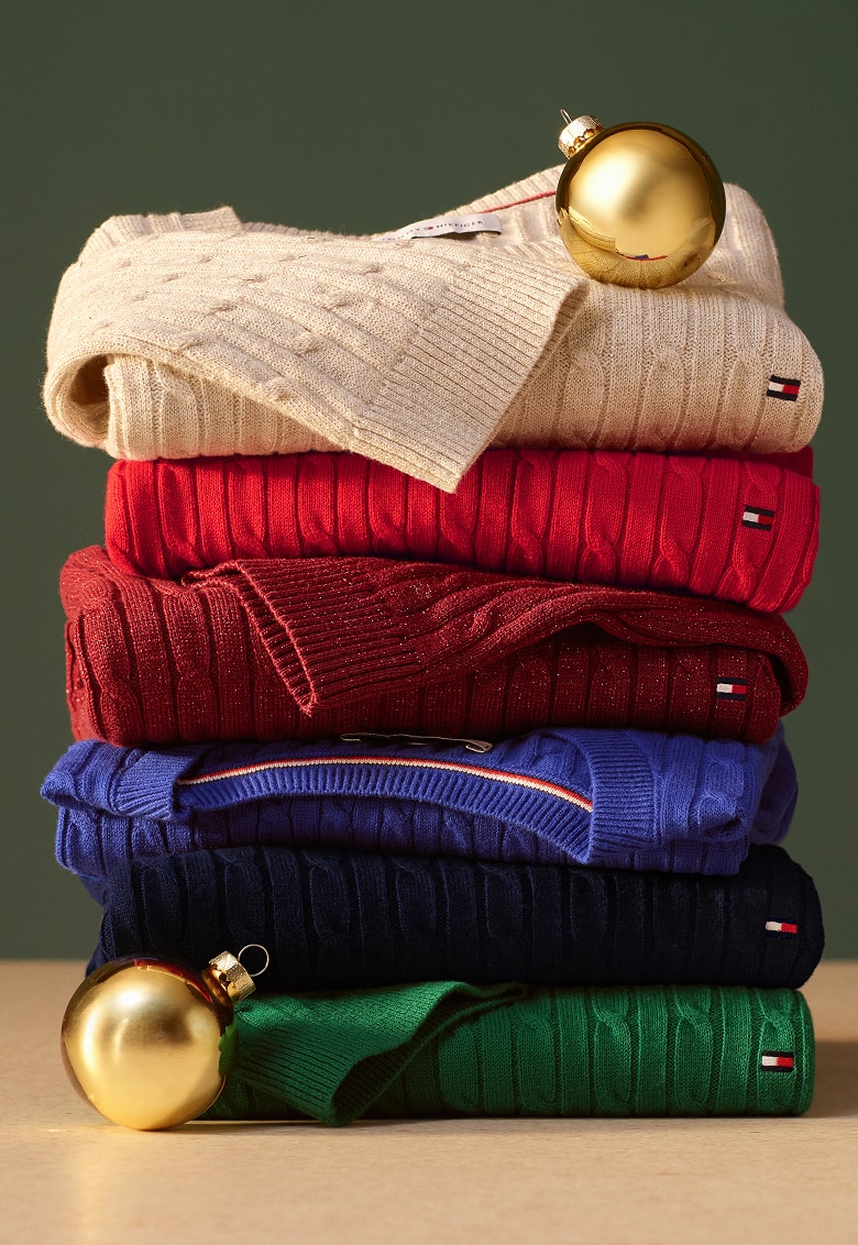 A stack of folded Tommy Hilfiger sweaters.